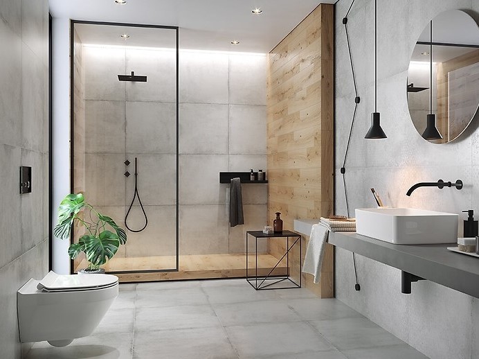 Łazienka z kabiną prysznicową, podłogą, umywalką i sedesem firmy Cersanit